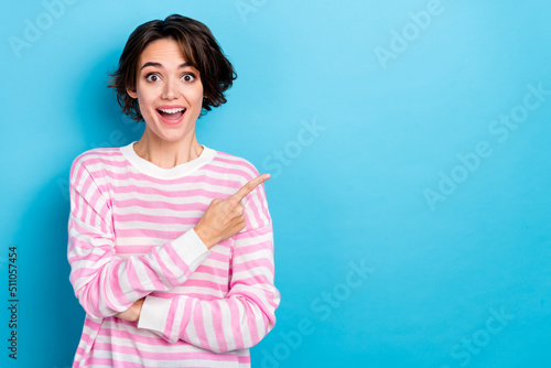 Photo of young funky excited cheerful woman advertising product on black friday sale isolated on blue color background