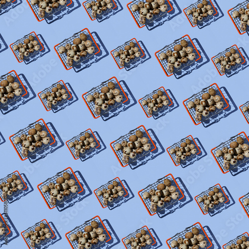 Seamless pattern of shopping baskets big and small with quail eggs on blue background. Top view. Website background.