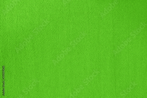 Green lime cotton fabric cloth texture for background, natural textile pattern.