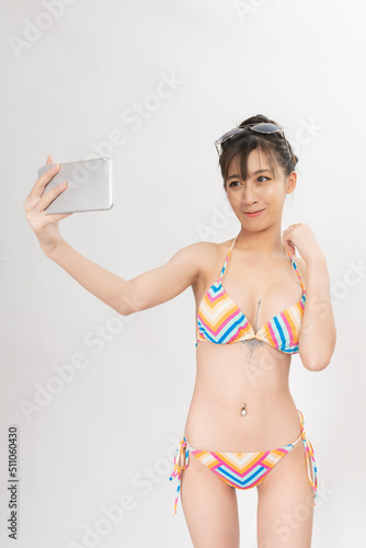 Foto Portrait of a young and attractive sexy asian female lady model wearing colorful