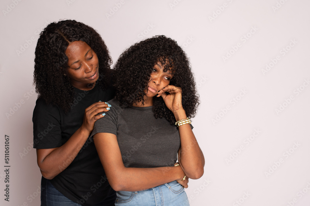 african lady supports and consoles her friend african lady supports and consoles her friend