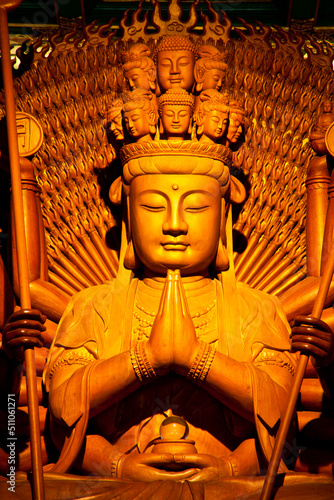 Wooden statue of a thousand hands of Guanyin God at Wat Boromracha Kanchanapisek Anusorn or Wat Leng Nei Yi 2, Thailand.
 photo