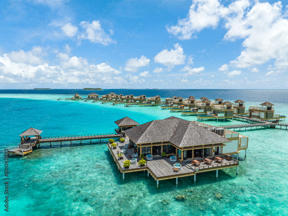 Tropical beach and water bungalows. Travel and tourism to luxury resorts in the Maldives islands. Summer holiday concept Maldive