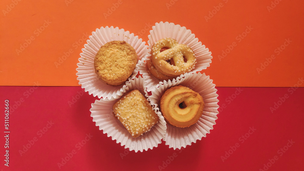 shapes of cookies in stack on red background shapes of cookies in stack on red background