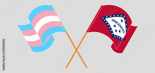 Crossed and waving flags of Transgender Pride and The State of Arkansas