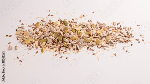 Mix of seeds for a salad. A pile of mixed seeds isolated on white background.
