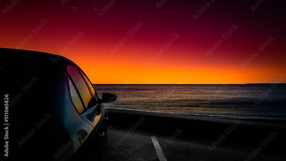 Seascape at sunrise on Cape Cod beach parking lot in Falmouth, Massachusetts. Travel road trip landscape at dawn. Seascape at sunrise on Cape Cod beach parking lot in Falmouth, Massachusetts. Travel road trip landscape at dawn.