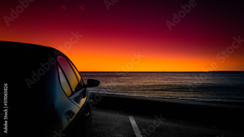 Seascape at sunrise on Cape Cod beach parking lot in Falmouth, Massachusetts. Travel road trip landscape at dawn. © Naya Na