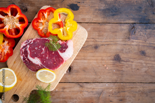 camping cook concept, Cooking Angus steak with onion and rosemary on iron pan in camping outdoor.