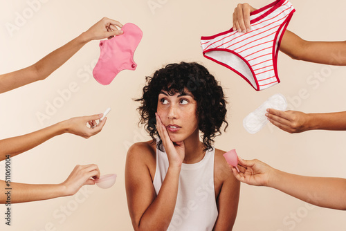 Woman contemplating the best sanitary choice to make