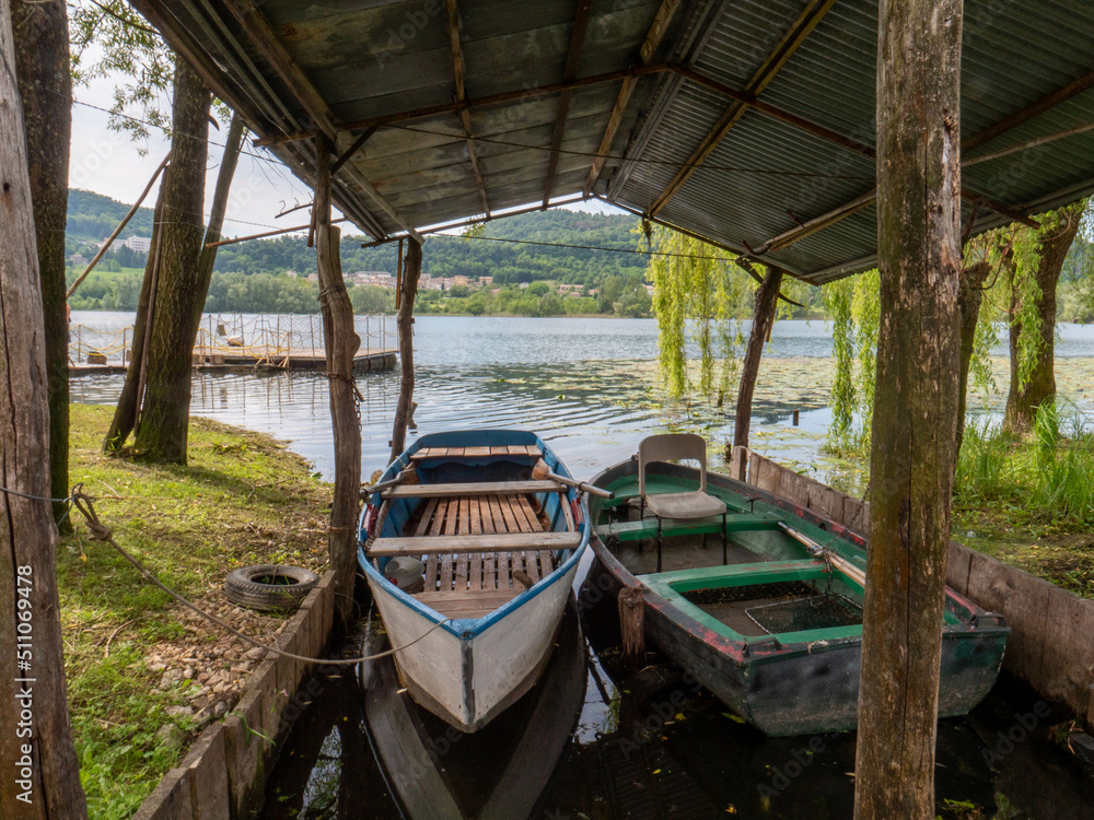 Old boats on lake side in Revine Lago italy