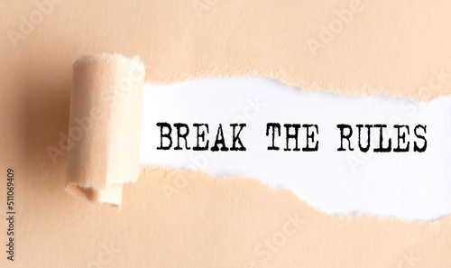 The text break the rules appears on a torn paper on white background.