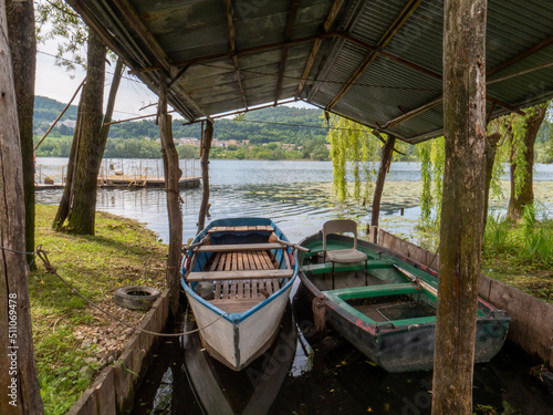 Old boats on lake side in Revine Lago italy