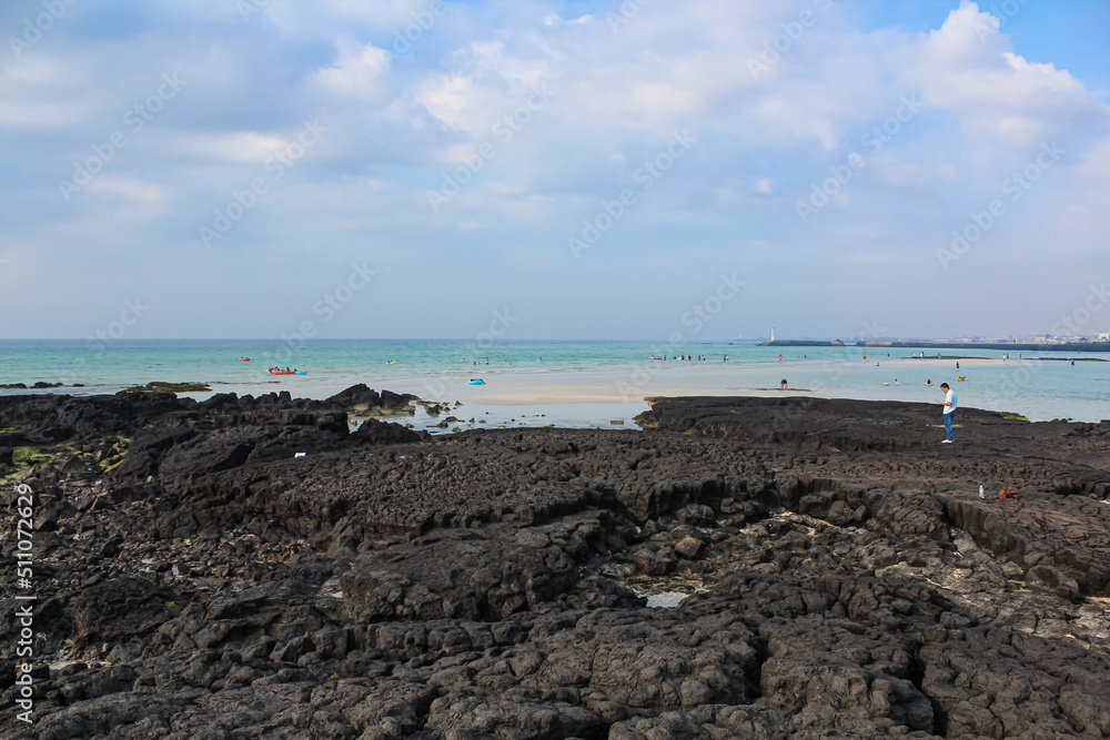 Blue sky and clouds above the horizon. stony shoreline Blue sky and clouds above the horizon. stony shoreline