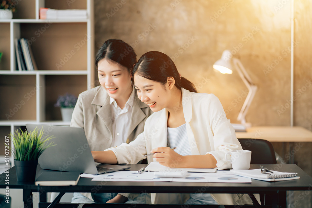 Business women using calculator at working with financial report. Business women using calculator at working with financial report.