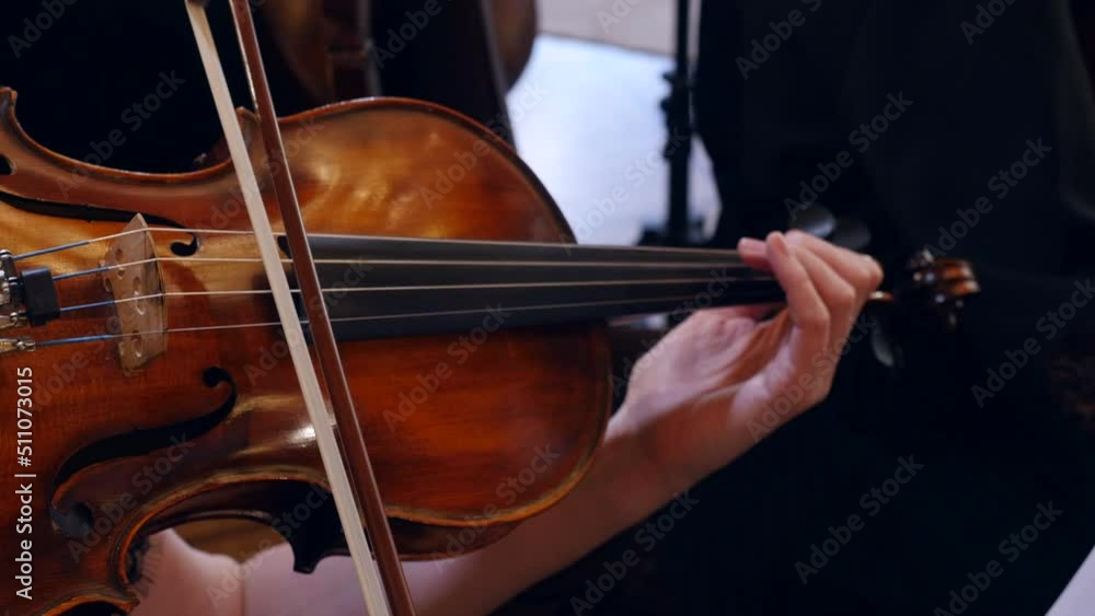 Violinist woman musician playing violin, Close-up view Violinist woman musician playing violin, Close-up view