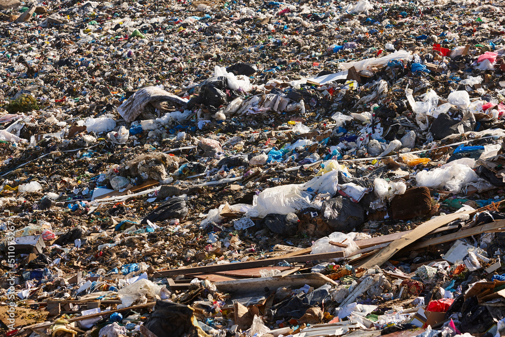 Open air garbage dump. Plastic waste pollution. Global warming. Consumerism