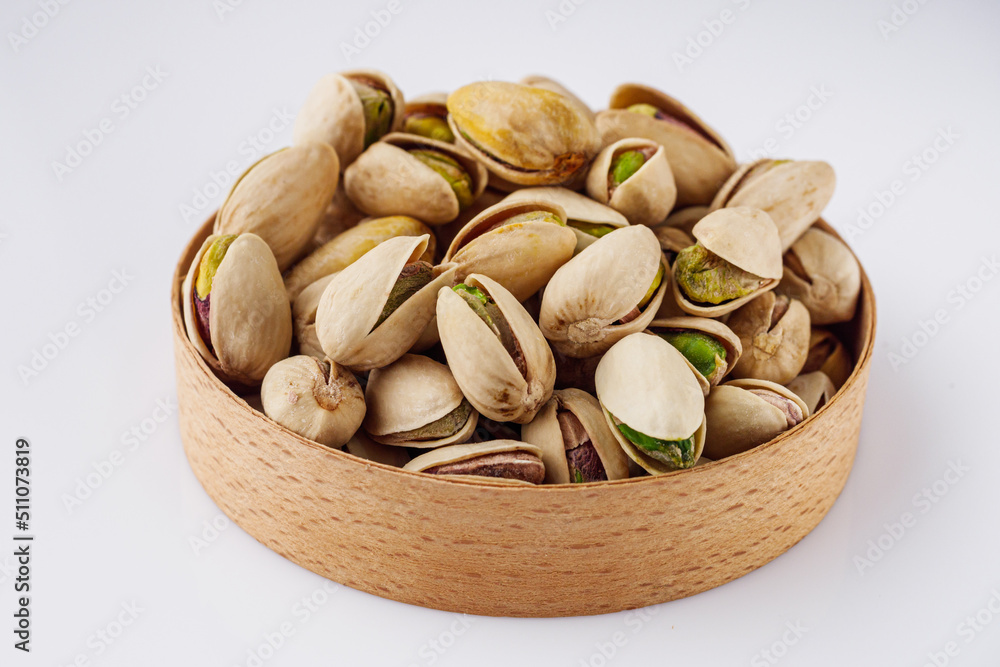 fresh salted pistachios on a white background fresh salted pistachios on a white background