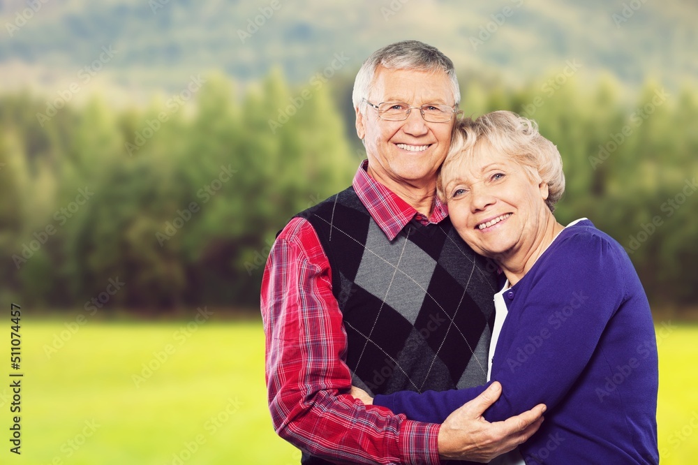 Perfect happy senior couple going for a walk in the park. Perfect happy senior couple going for a walk in the park.