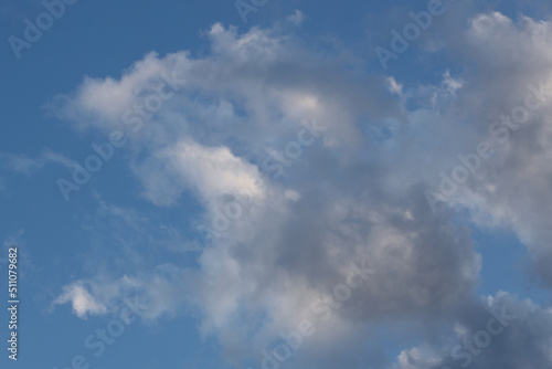 White clouds against the blue sky.