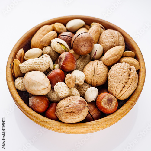 set of different nuts on a white acrylic background
