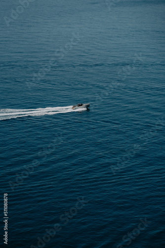 Positano, Amalfi Coast in Italy- the view of peaceful blue sea and luxury charter boats, seaside, nature, waves, landscape