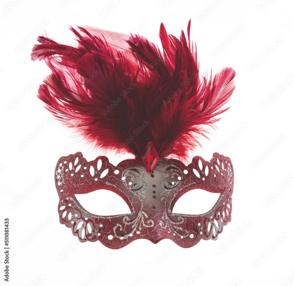 Carnival mask red color with feather isolated on a white background.