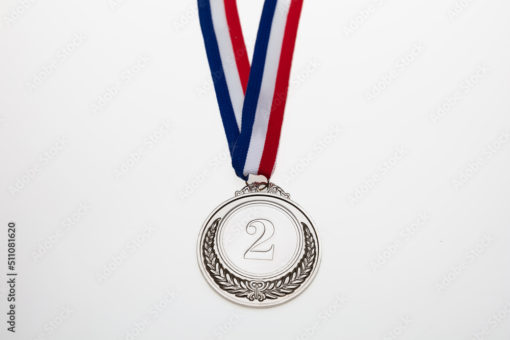 Silver medal. Champion trophy award and ribbon. Prize in sport for second place isolated on white Silver medal. Champion trophy award and ribbon. Prize in sport for second place isolated on white