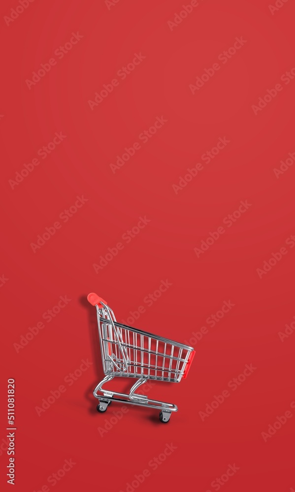 Mini shopping trolley for shopping on background, consumer concept, minimalism. Sale