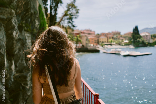 Woman touring varenna lake como photo