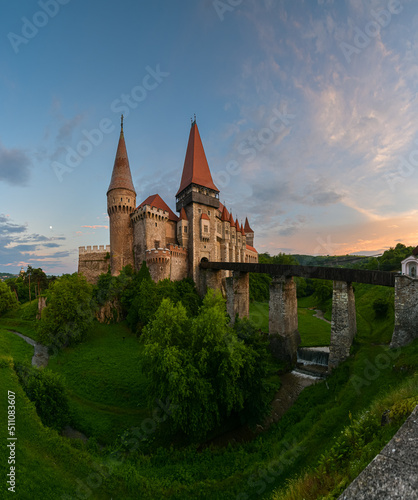 Beautiful summer sunset at Corvin (Hunyad) Castle in Hunedoara, an amazing landmark from Transylvania, one of the biggest castles in Europe. Travel to Romania.