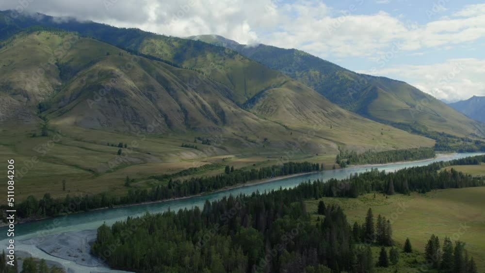 Blue Katun river in the middle of mountains of Ak-Kem valley in Altai, Siberia, Russia. Beautiful autumn nature landscape at during daytime. Aerial view from a drone Blue Katun river in the middle of mountains of Ak-Kem valley in Altai, Siberia, Russia. Beautiful autumn nature landscape at during daytime. Aerial view from a drone