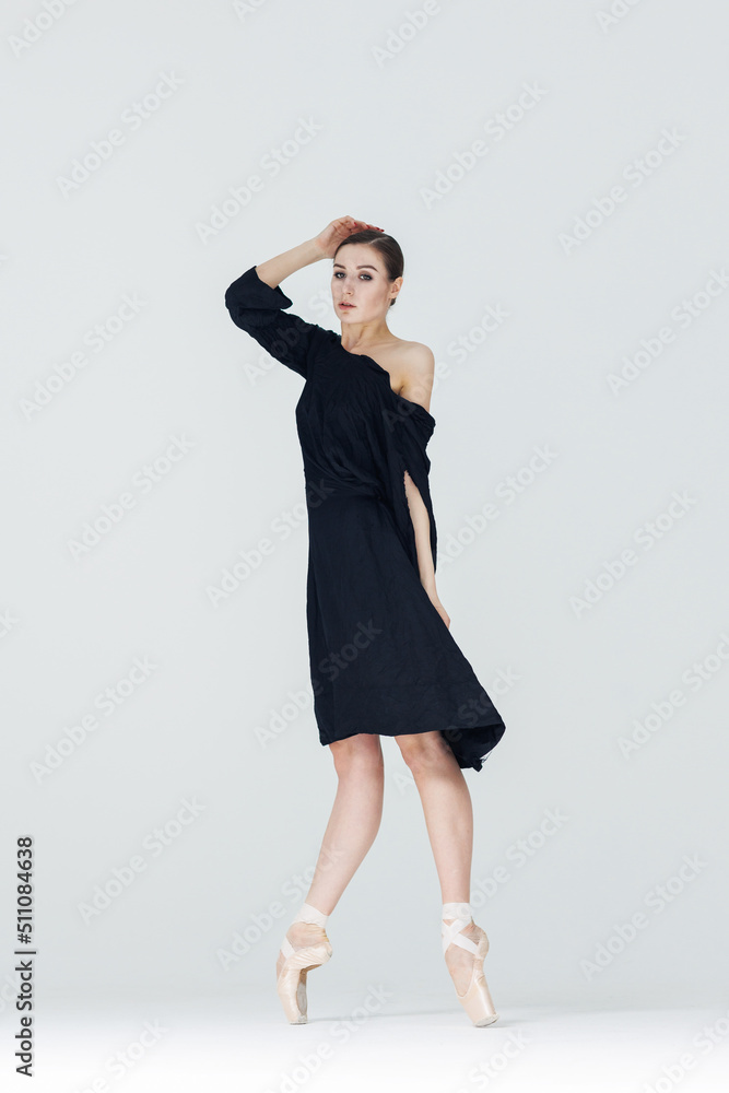 Elegant ballerina. A young graceful ballet dancer, dressed in pointes shoes demonstrates her dance skills. Power and refinement of classical ballet. Elegant ballerina. A young graceful ballet dancer, dressed in pointes shoes demonstrates her dance skills. Power and refinement of classical ballet.