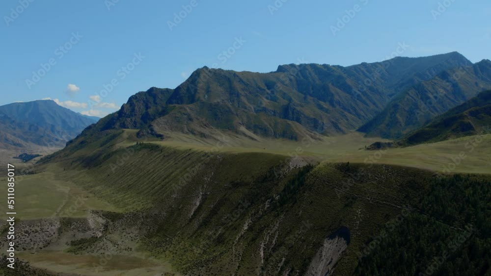 Green mountains of Altai under clear blue sky, Siberia, Russia. Beautiful summer nature landscape at during daytime. Aerial view from a drone Green mountains of Altai under clear blue sky, Siberia, Russia. Beautiful summer nature landscape at during daytime. Aerial view from a drone