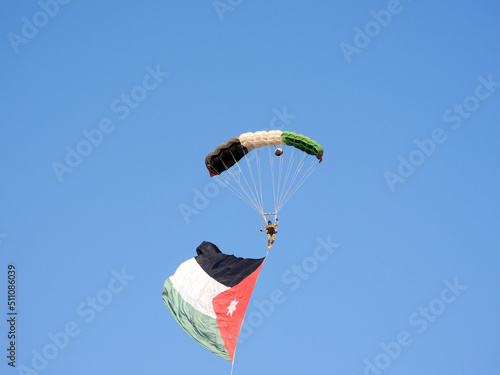 Amman, Jordan - jordanian flag and paratrooper in air