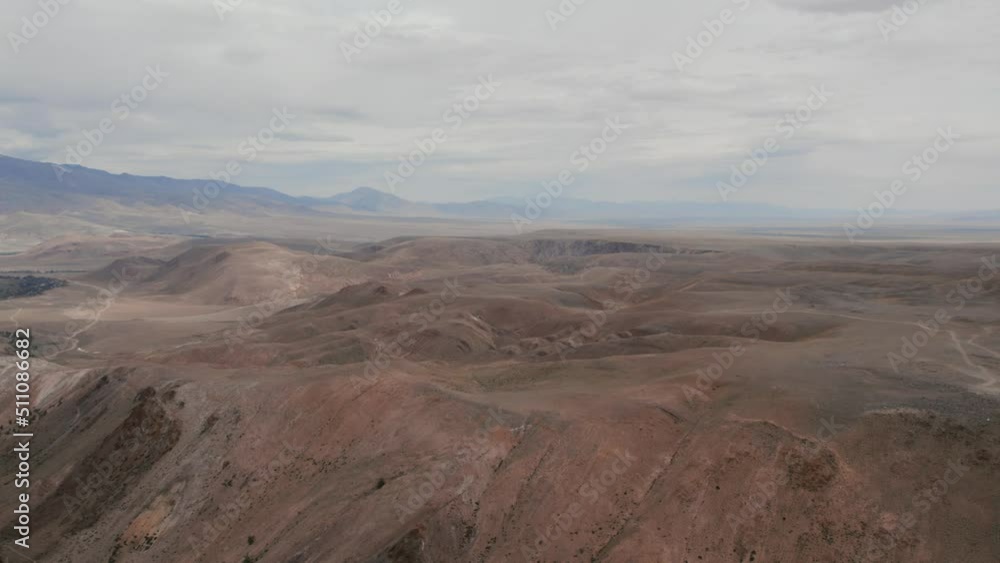 Mars valley with red mountains in Altai, Kyzyl-Chin valley, Siberia, Russia. Beautiful summer nature landscape at during daytime. Aerial view from a drone