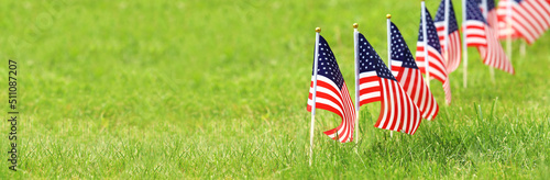 American flags on grass. Independence Day concept. USA holiday.