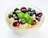sweet porridge with quinoa and berries on a white background