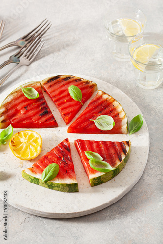 grilled watermelon slices with lemon and basil. summer dessert