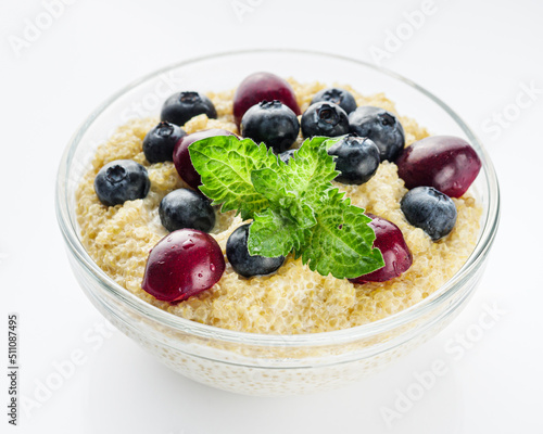 sweet porridge with quinoa and berries on a white background