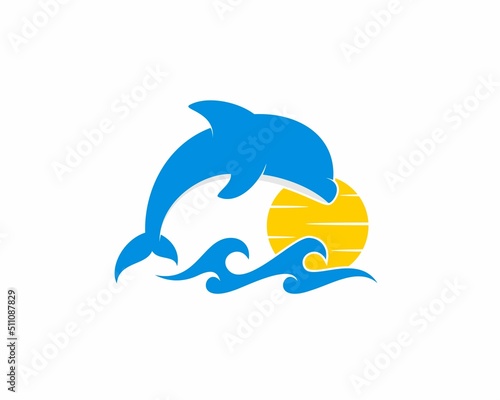 Jumping dolphin on the sea wave logo