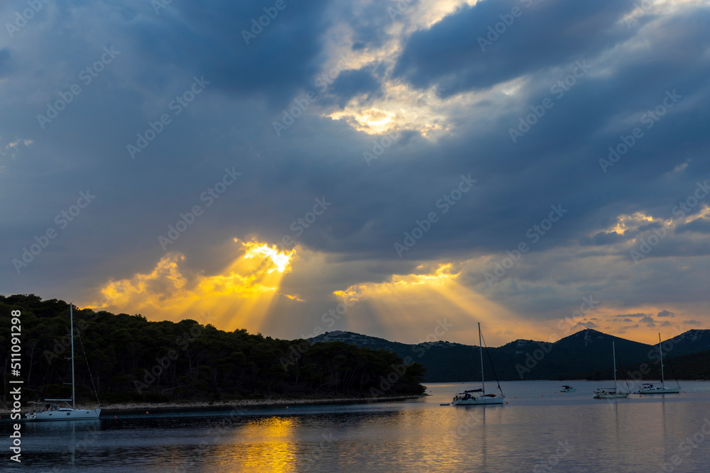 sunset cloudscape in the bay of village Brgulje on island Molat in Croatia