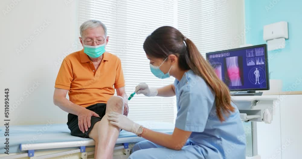 doctor examining patient knee doctor examining patient knee