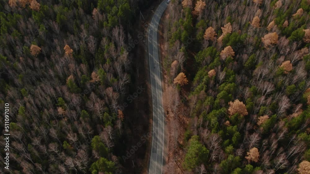 Panorama of autumn forest and road in Ural, Russia. Beautiful autumn nature landscape at during daytime. Aerial view from a drone Panorama of autumn forest and road in Ural, Russia. Beautiful autumn nature landscape at during daytime. Aerial view from a drone