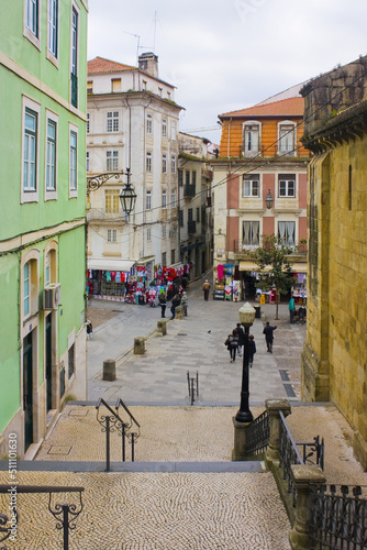 Picturesque street with ancient houses in Old Town of Coimbra, Portugal