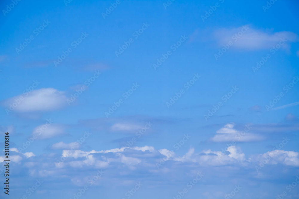 Cumulus clouds. White clouds on a blue background. Cumulus clouds. White clouds on a blue background.