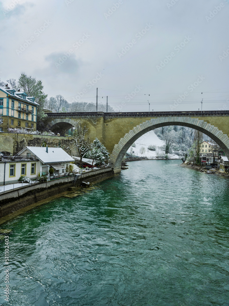 Nydeggbrucke bridge over river Aare during snowfall in Bern, Switzerland