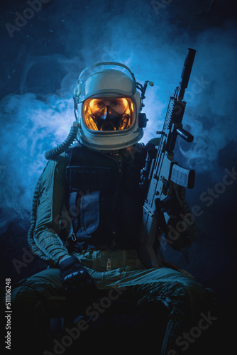Принти на полотні Spaceman or star trooper in the helmet and with rifle in the blue smoke