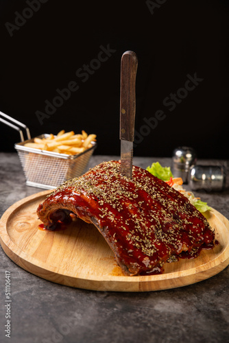 Grilled pork ribs BBQ on black plate,Top view,World food day
