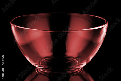Red glass bowl in black background